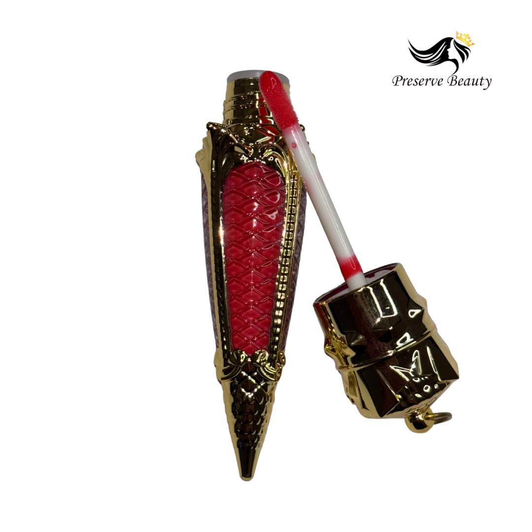 Luxury lip gloss with coconut oil in gold packaging by Preserve Beauty